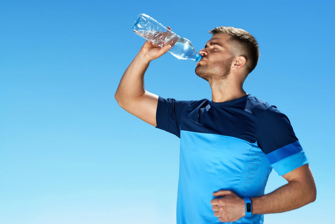 Man Drinking Water After Running. Portrait